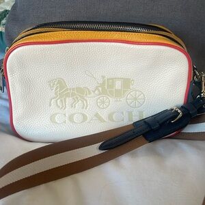 Never used coach crossbody. Cream with beautiful yellows, reds and blues